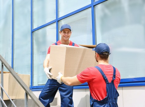 Professional packing team preparing household boxes for a Putney move