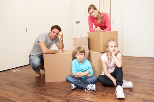 Careful loading of household items for a move in Putney