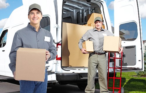 Packing boxes and furniture for storage in Putney