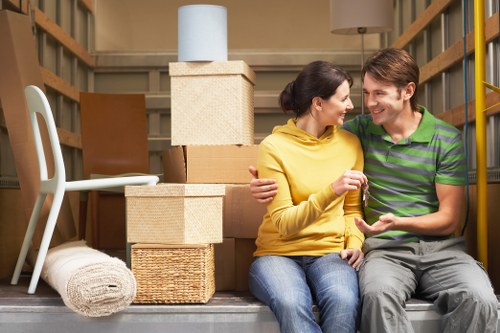 Business movers handling office files and equipment in South West London